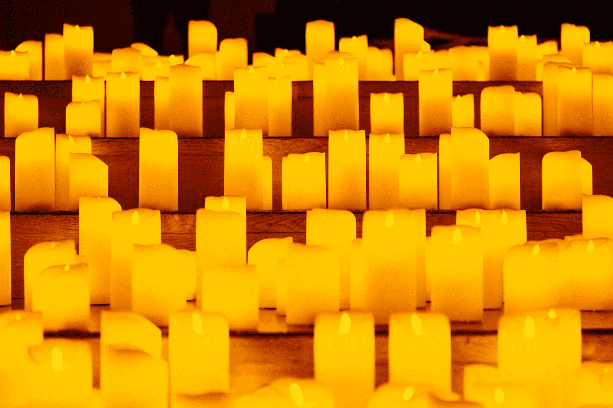 Hundreds of candles flicker on steps