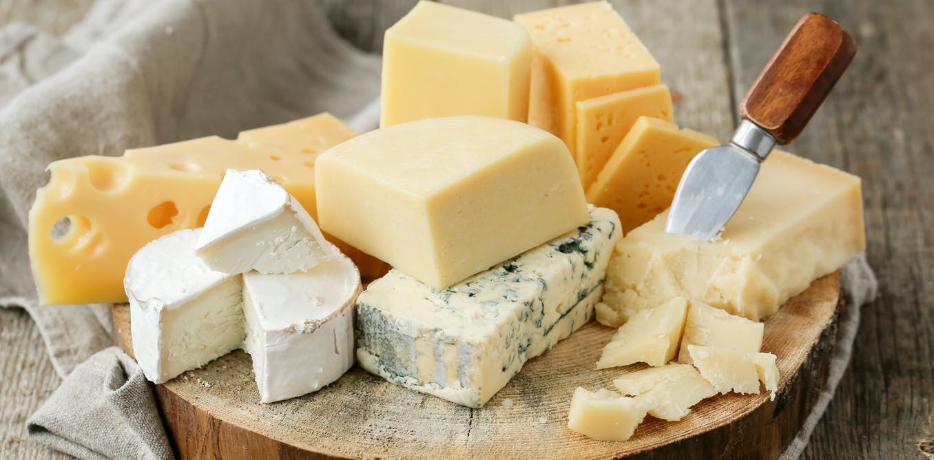 a selection of cheese on a board