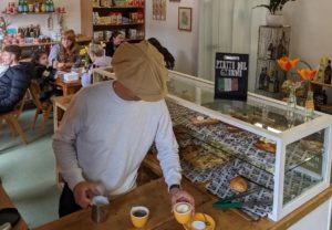 lupo-prestwich-man-pouring-coffee-into-cup-on-counter