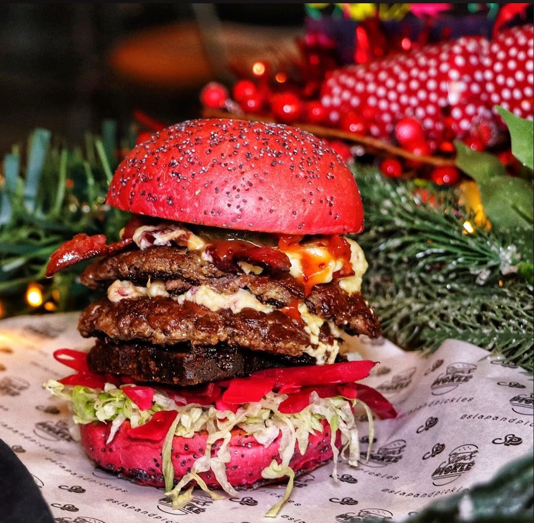 slap-and-pickle-all-i-want-for-christmas-burger-with-pink-bun-festive-food-manchester