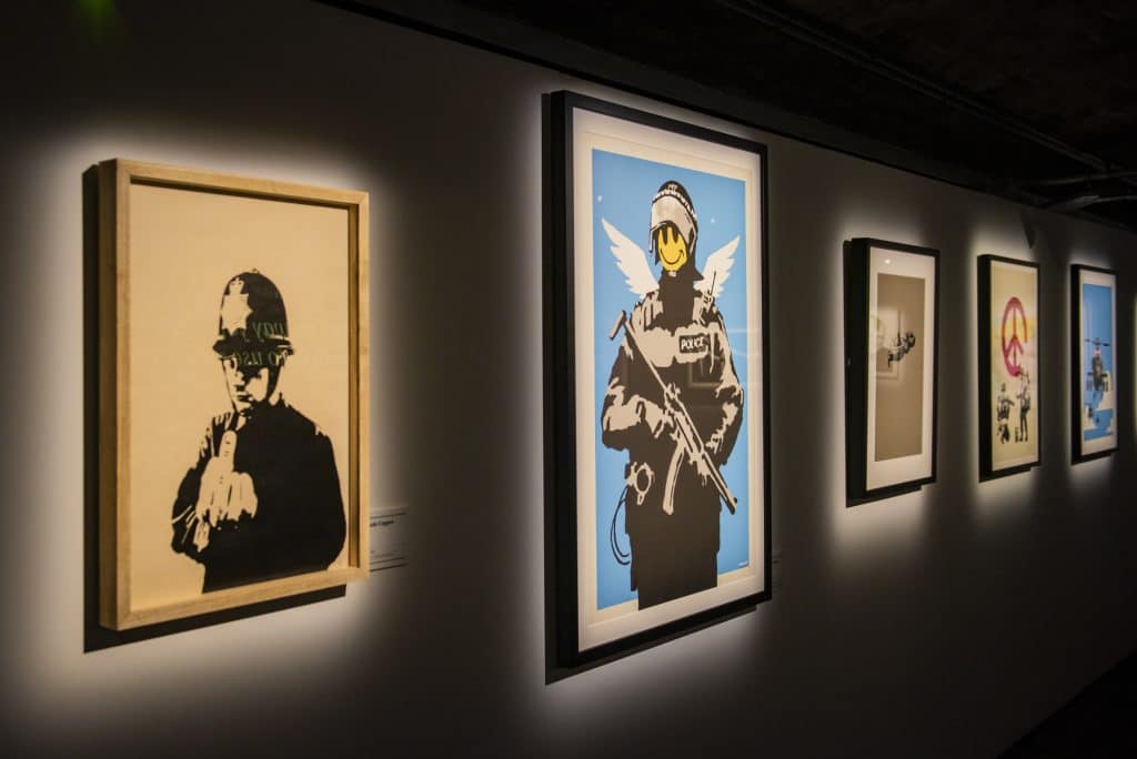 row-of-portraits-art-of-banksy-exhibition-coming-to-manchester-media-city