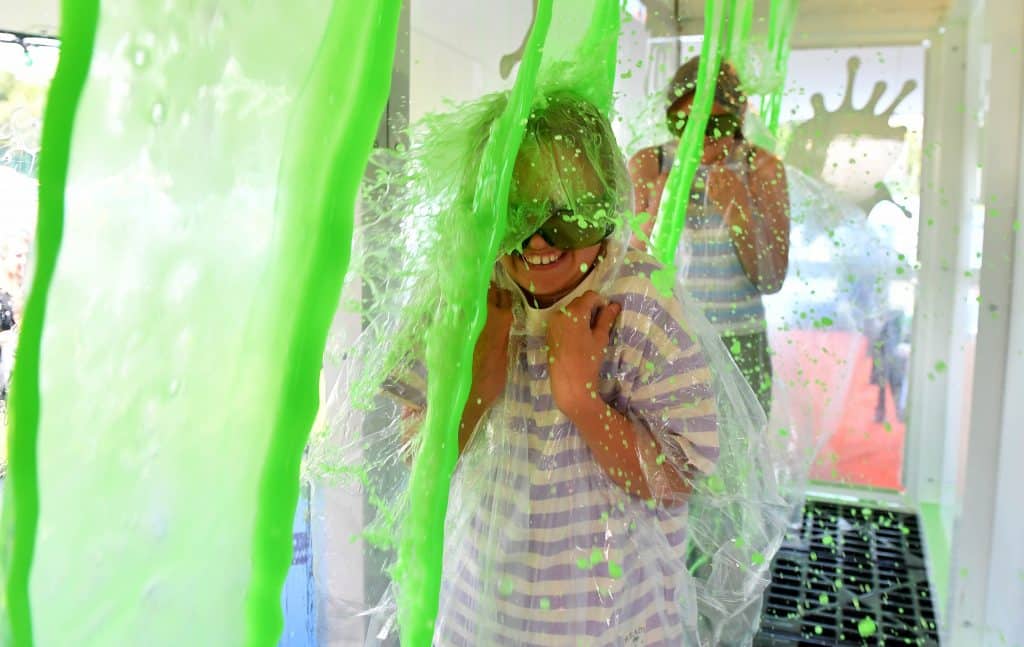 a child being slimed at The Nickelodeon Experience