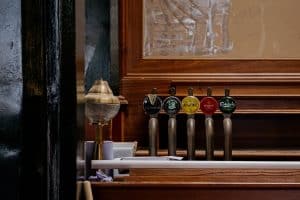 beers-on-draft-with-wooden-panelling-behind