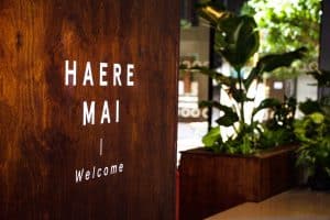 interior-of-new-zealand-restaurant-and-bakery-with-wall-reading-haere-mai-welcome-in-maori