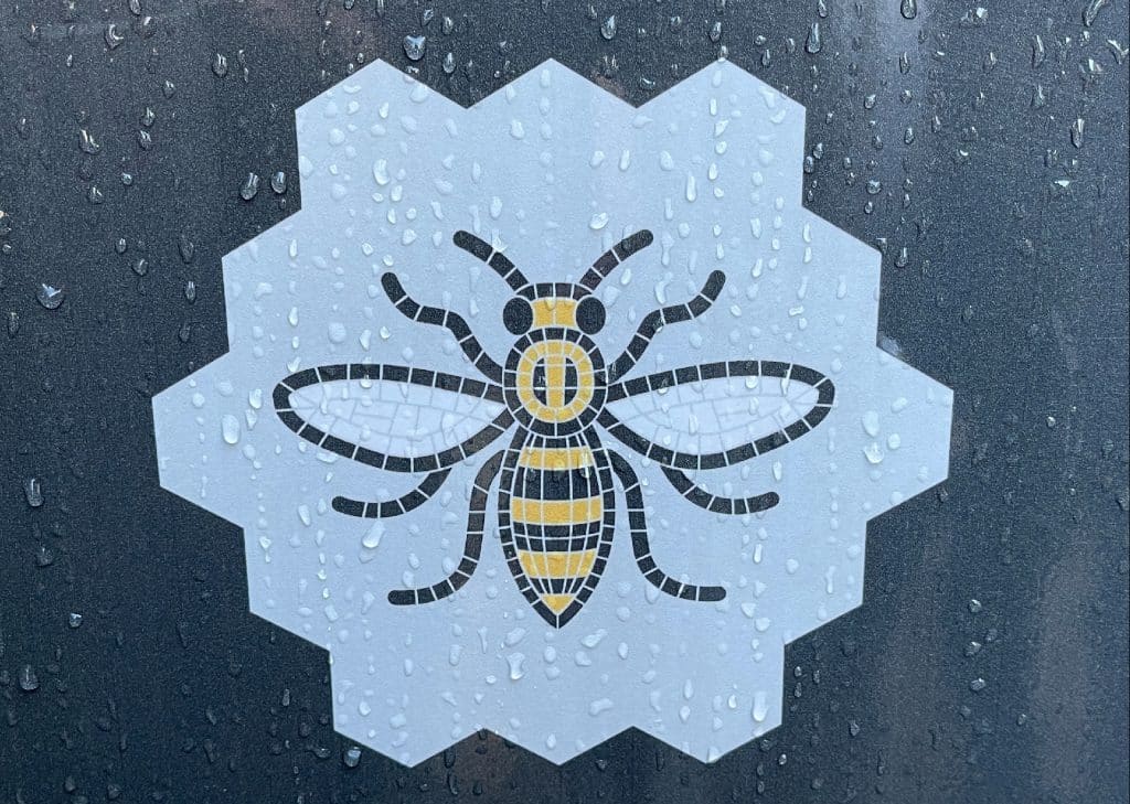 manchester-bee-sign-on-rainy-window