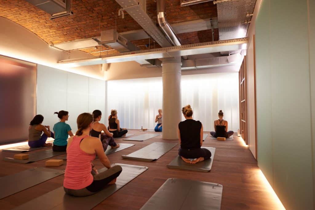 people-sat-on-mats-at-blok-manchester-studio-which-is-offering-free-classes