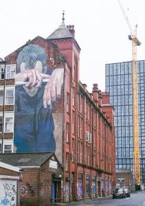 mural-on-red-brick-building-in-manchester