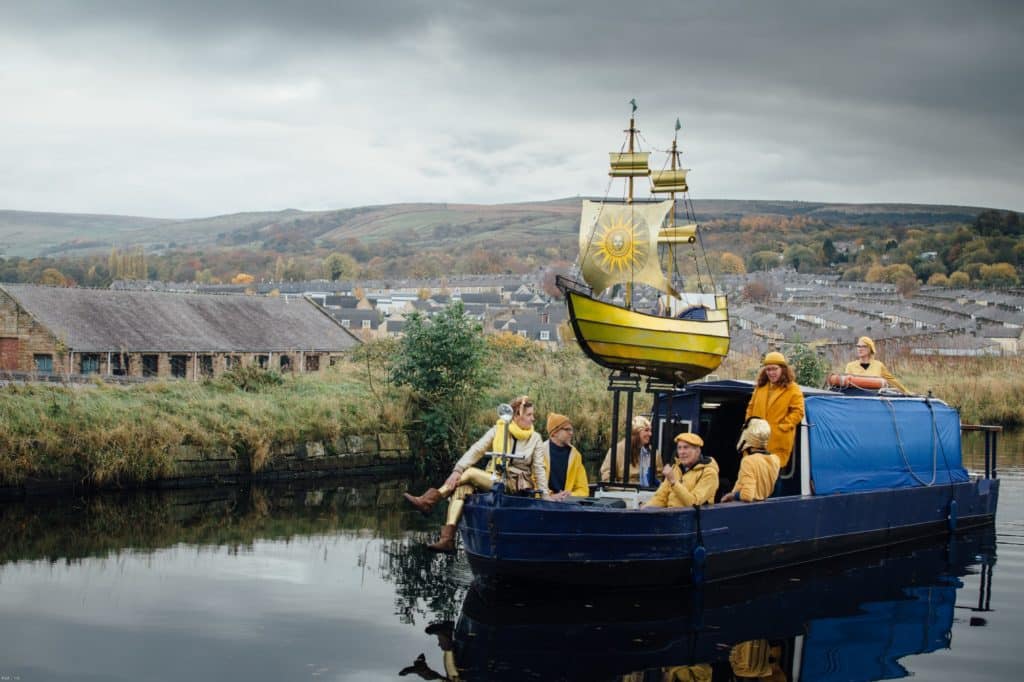 opal's-comet-with-crew-on-board-going-along-canal-waterways-in-burnley