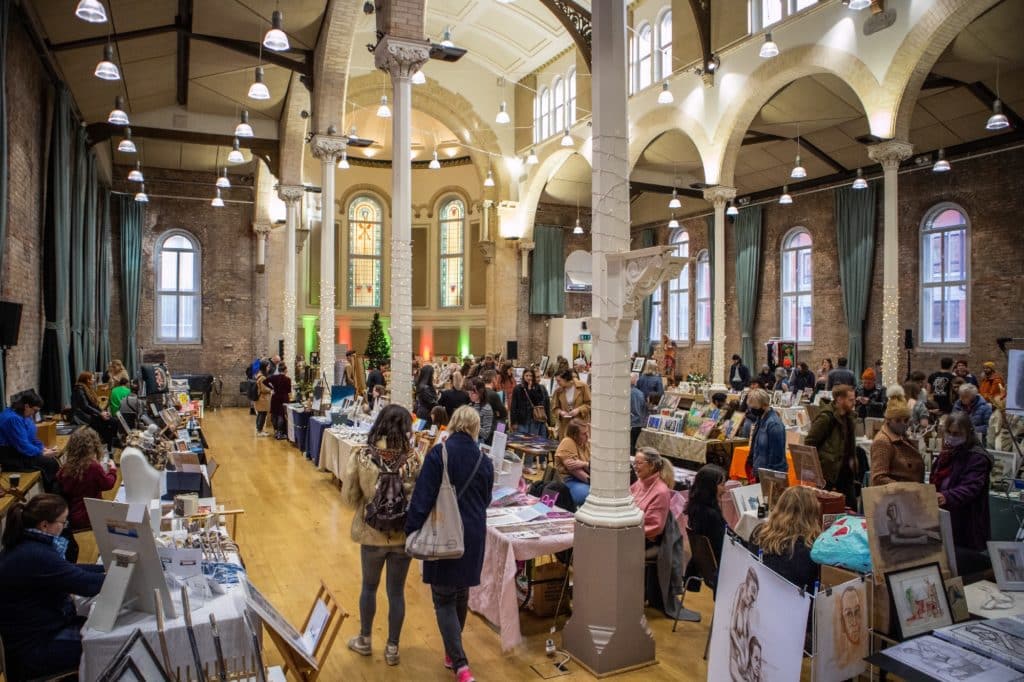 visitors-walking-past-stalls-at-cotton-on-mcr-art-all-dayer-event