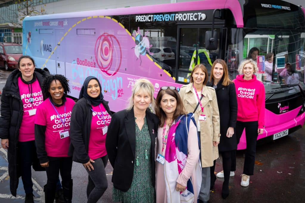 women-stood-next-to-pink-boobee-bus-breast-cancer-screening-campaign