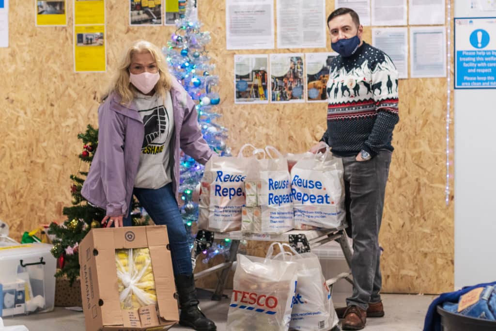muse-lifeshare-christmas-two-people-helping-with-shopping-bags-with-food-to-feed-the-homeless