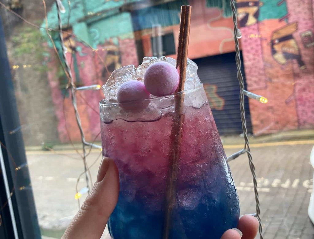 purple-cocktail-with-bo-bons-on-top-at-the-font