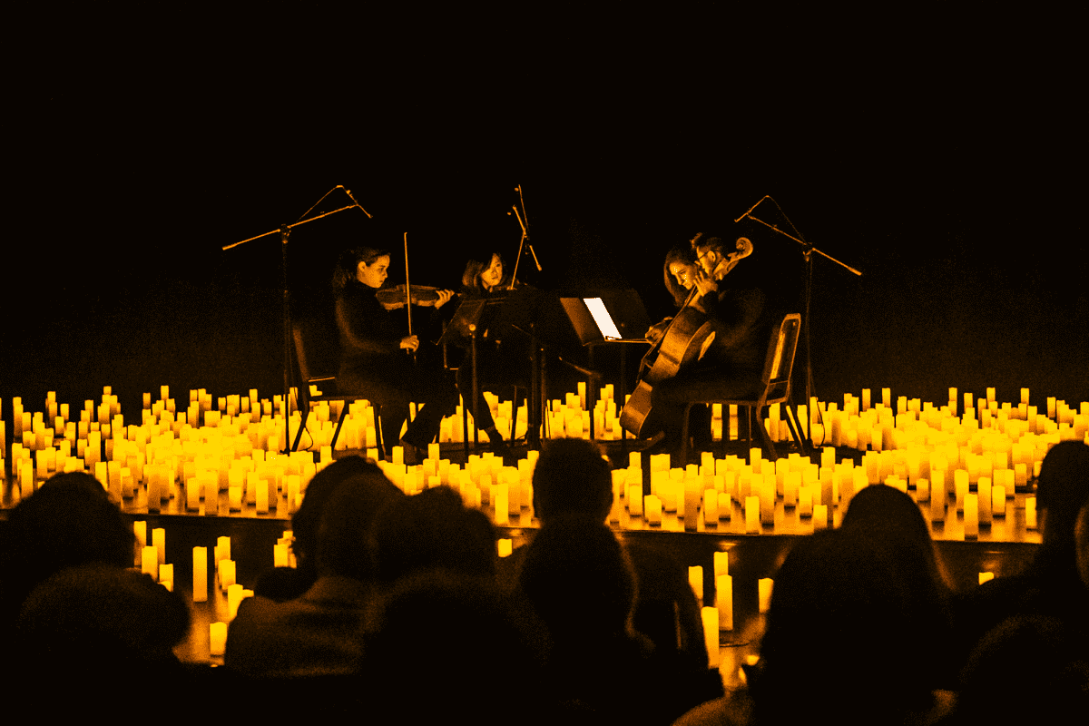 String quartet performing by candlelight 
