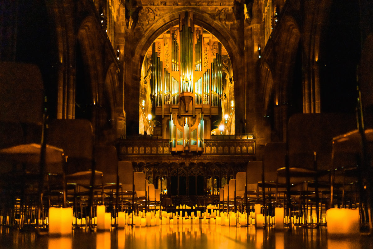 Candles covering the floor inside Manchester Cathedral for a Candlelight concert.