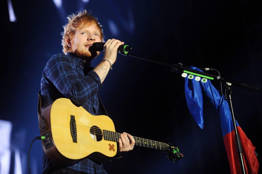 ed-sheeran-performing-on-stage-with-guitar-set-to-tour-uk-incuding-manchester