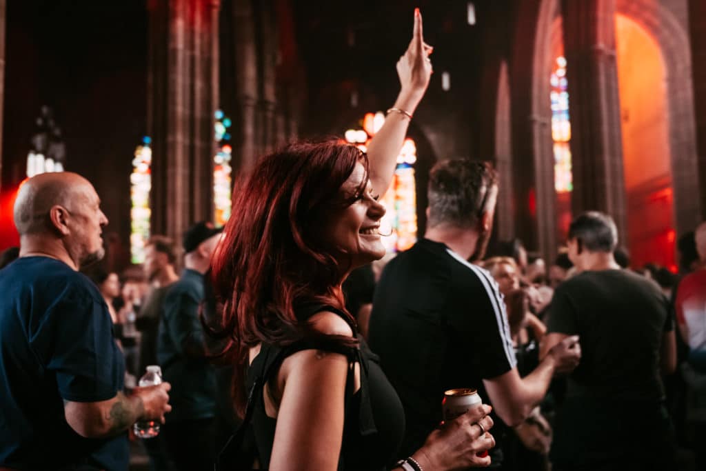 crowds dancing at a Manchester 360 event in Manchester Cathedral