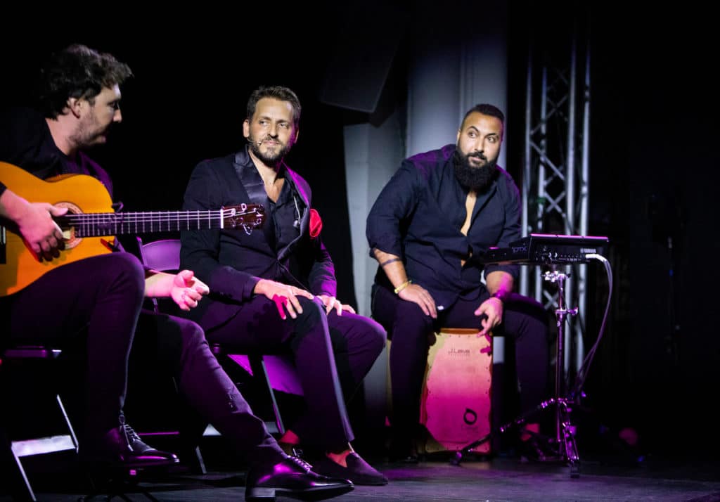 a flamenco band performing on stage