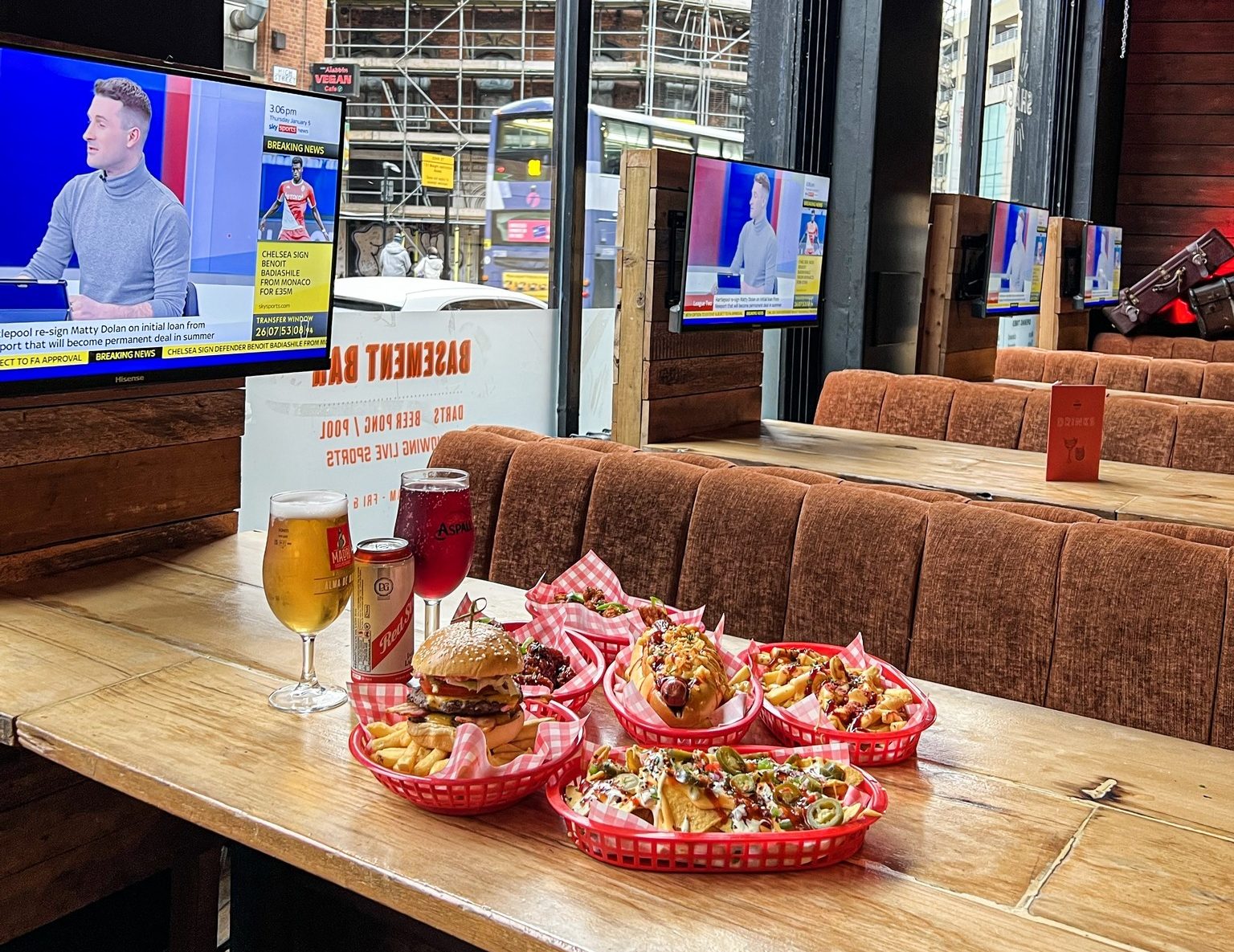 shack-manchester-food-on-table-tv-screens
