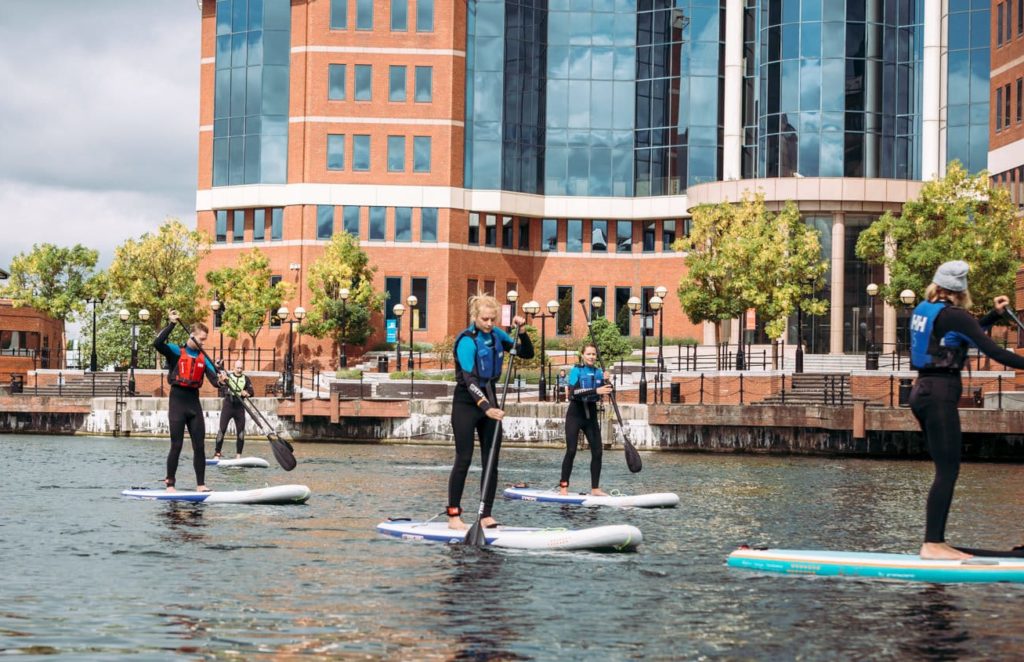 Salford-watersports-centre-people-paddleboarding-in-manchester