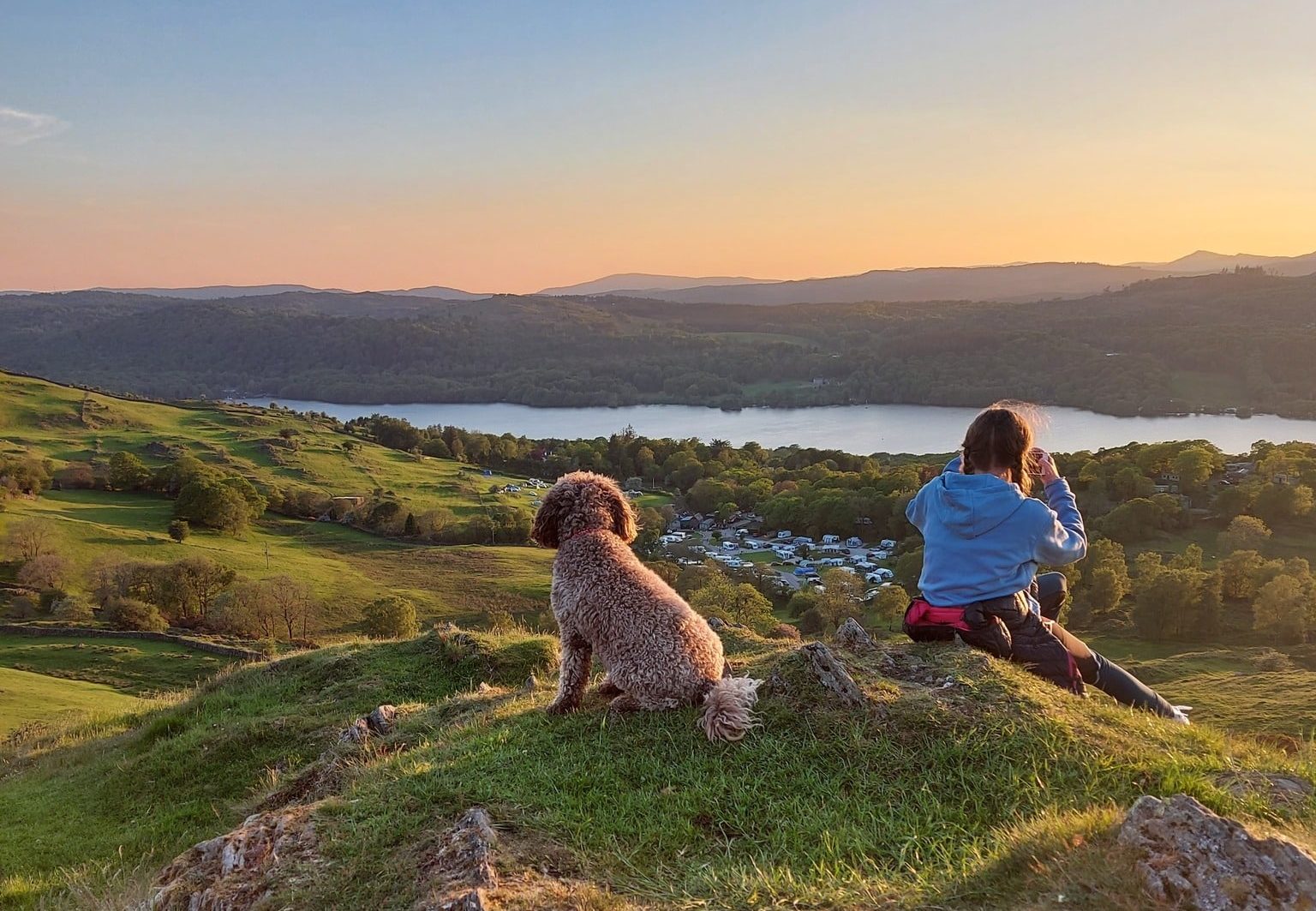 park-cliffe-dog-girl-overlooking-lake-sunset