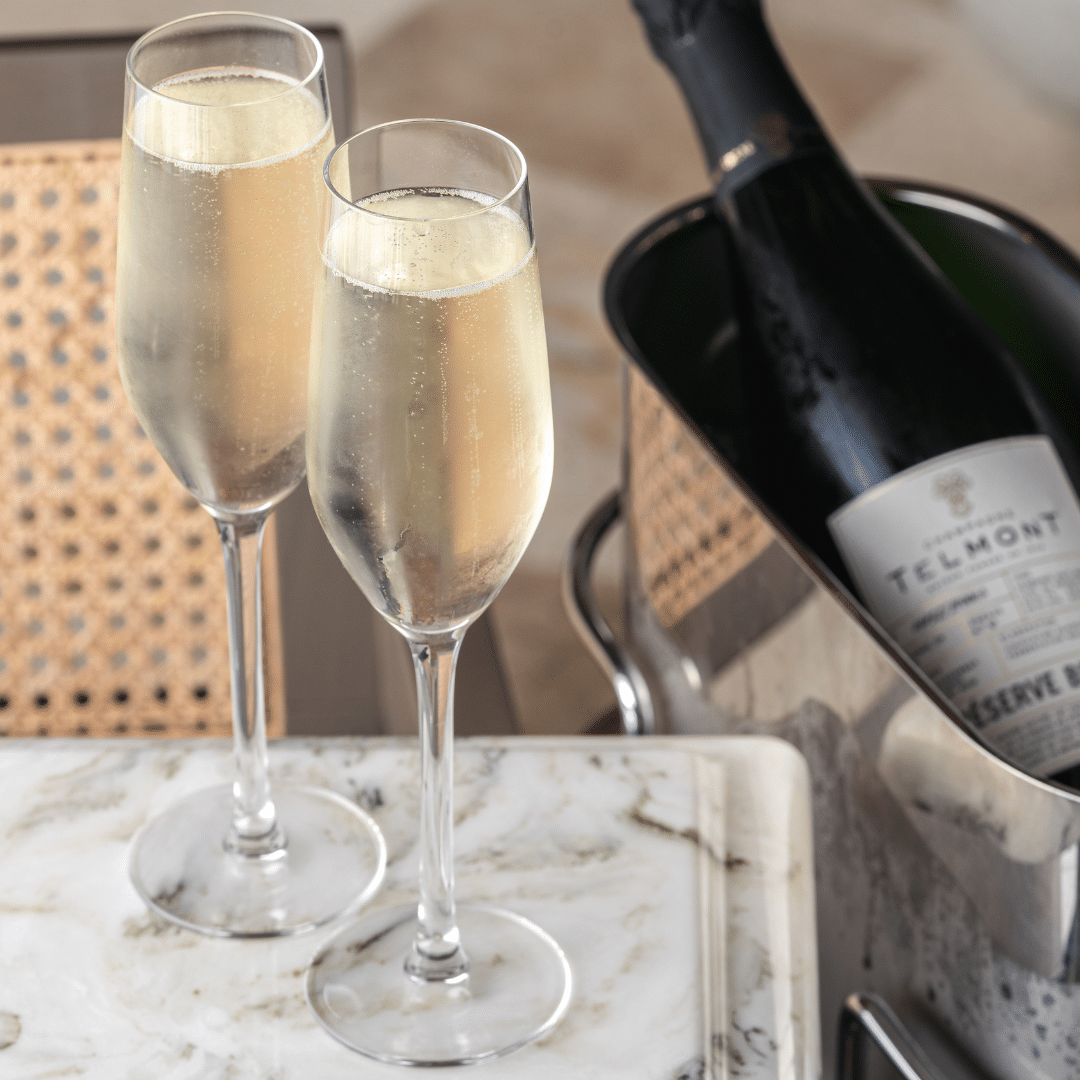 champagne-bottle-glasses-the-alan-