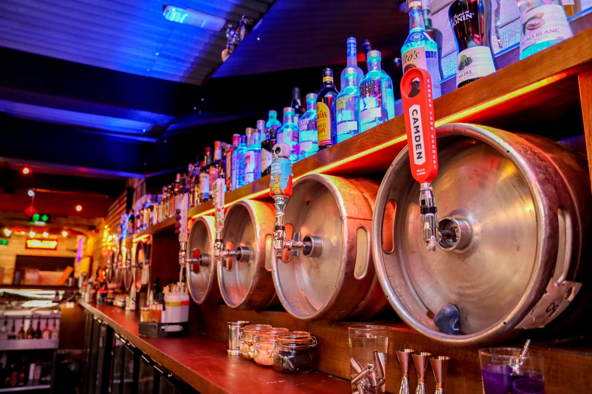 kegs-and-spirit-bottles-lined-up-across-bar
