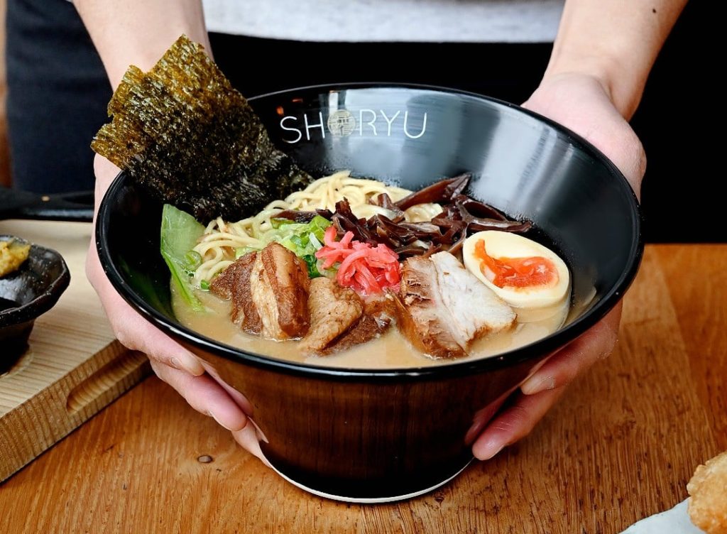 person-holding-bowl-of-miso-tonkotsu-ramen-shoryu-ramen