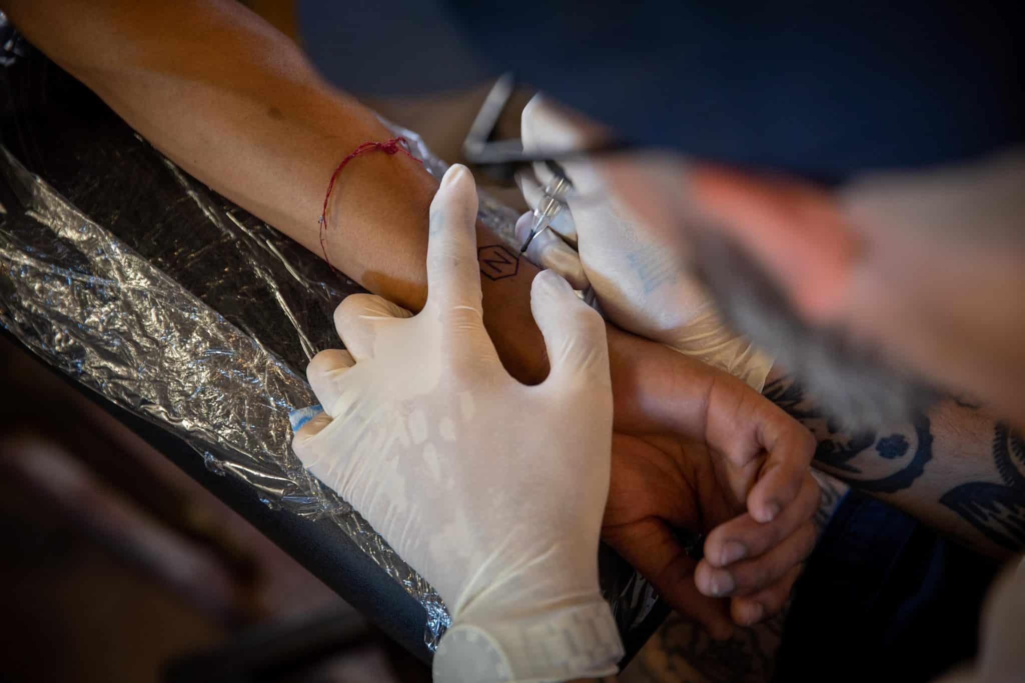 human-rights-tattoo-close-up-needle-skin