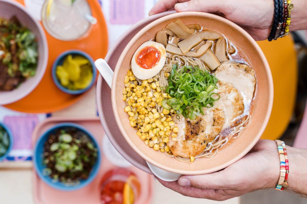 bowl-of-ramen-topped-with-boiled-egg-chicken-and-sweetcorn