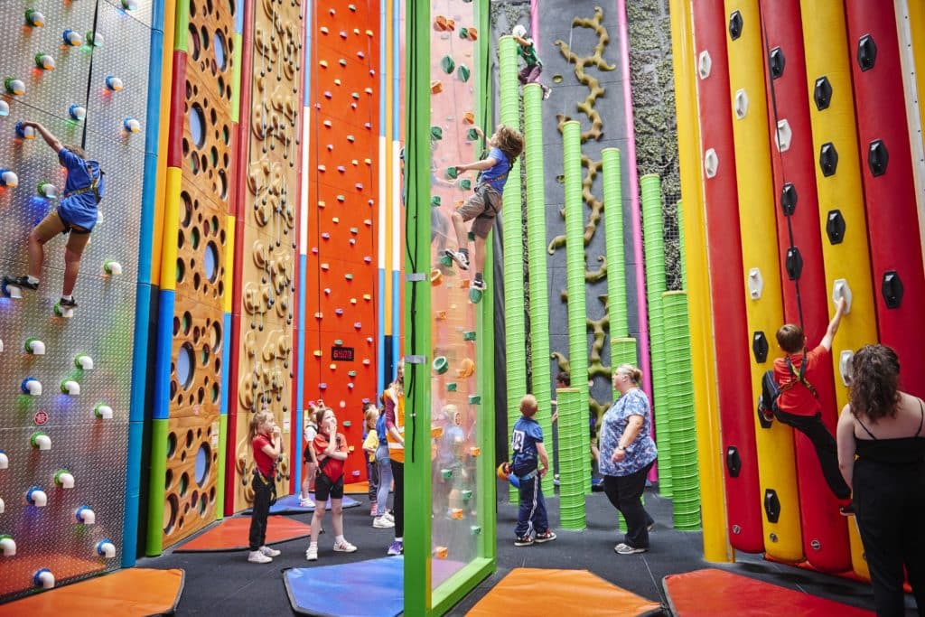 children-climbing-up-climbing-walls-at-rock-up-manchester