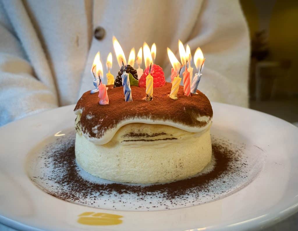fluffy-fluffy-pancake-with-candles-on-to-celebrate-birthday