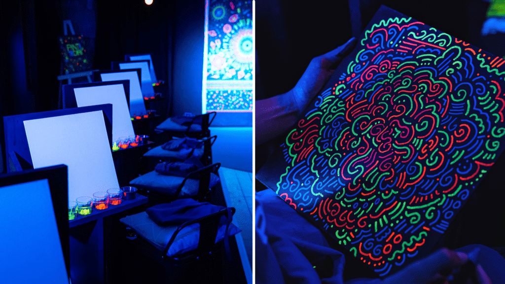 Canvases on display under neon lights at Paint in the Dark